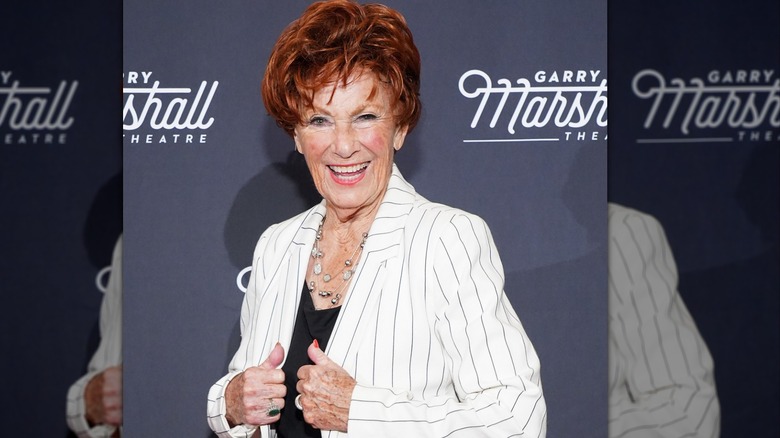 Marion Ross smiling while showing off her white and black pinstriped jacket at the Garry Marshall Theatre