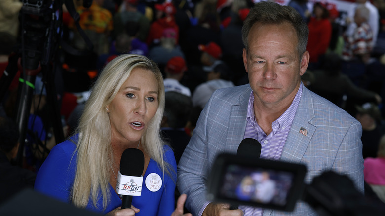 Marjorie Taylor Greene and Brian Glenn at a campaign rally for Donald Trump in March 2024