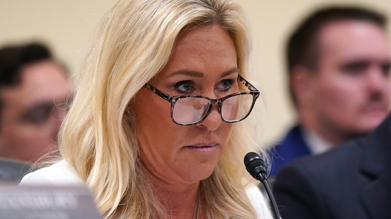 Marjorie Taylor Greene glaring at someone over her glasses