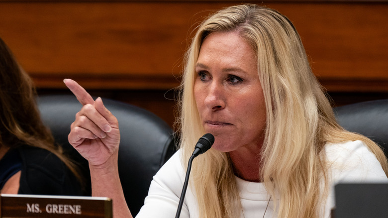 Marjorie Taylor Greene pointing a finger at someone during a House meeting