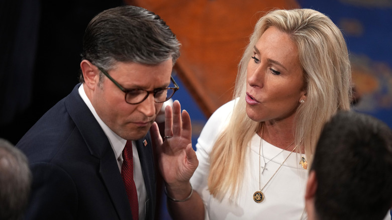 Marjorie Taylor Greene talking to Mike Johnson