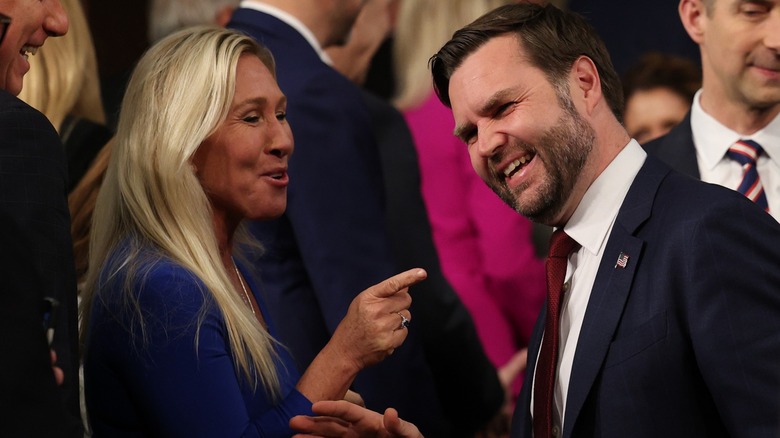 Marjorie Taylor Greene and JD Vance laughing together