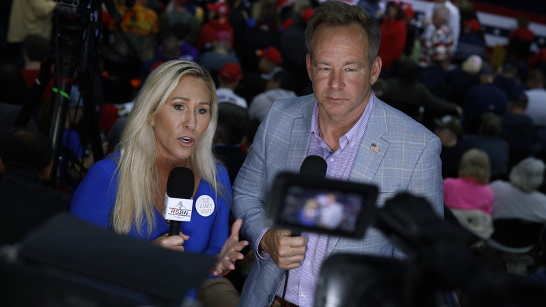 Marjorie Taylor Greene and Brian Glenn addressing the media
