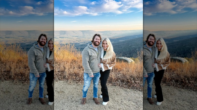 Lauren Greene Sanders with husband on a mountainside.