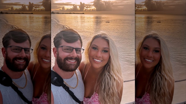 Lauren Greene Sanders with her husband on a beach.