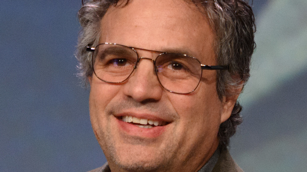 Mark Ruffalo smiling wearing glasses 