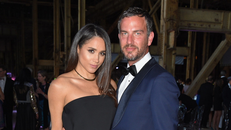 Meghan Markle and Markus Anderson posing together at an event
