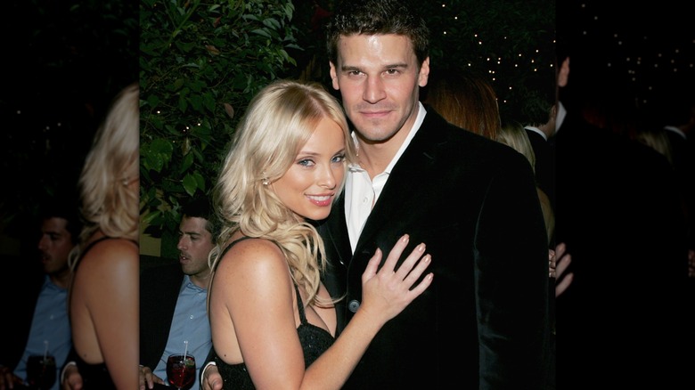 Jaime Bergman smiling while embracing David Boreanaz.