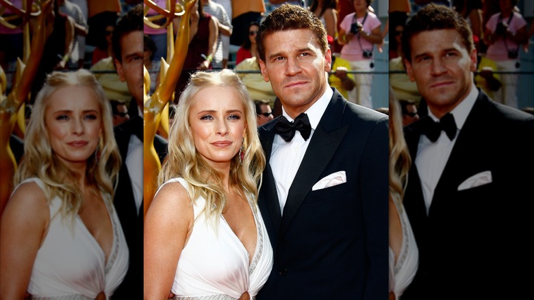 David Boreanaz in a tuxedo posing with Jaime Bergman in a white dress.
