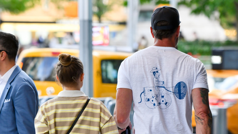 Kristen Bell and Dax Shepard photographed from behind while walking