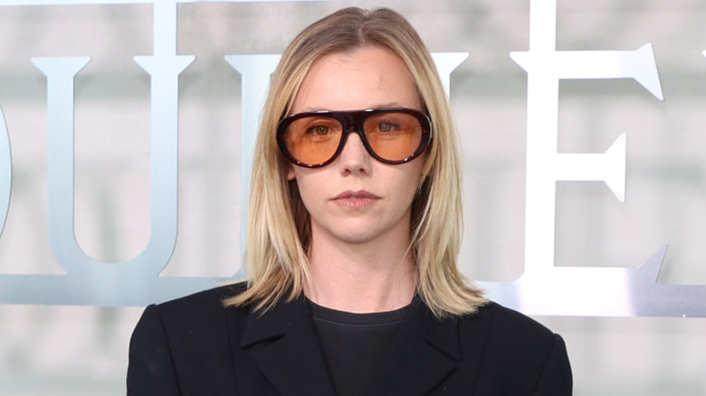 Lauren Lyle looking serious with sunglasses