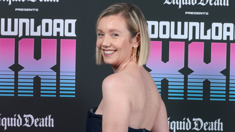 Lauren Lyle smiling and looking over her shoulder