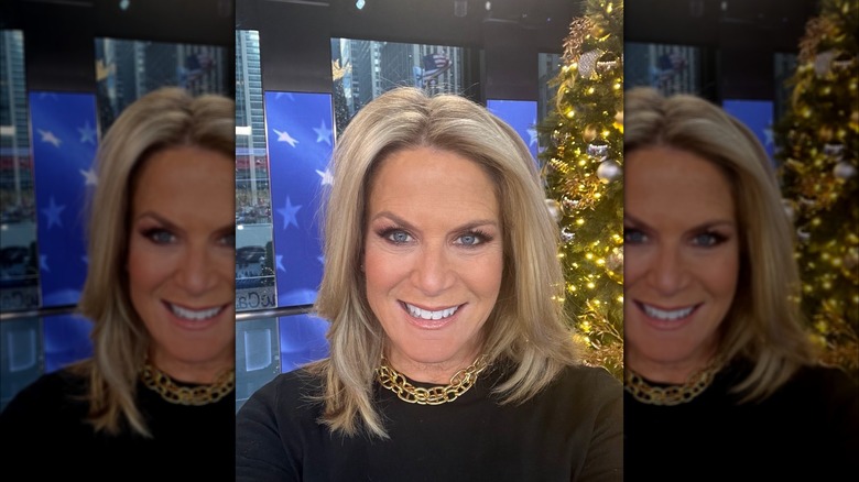 Martha MacCallum in front of a Christmas tree