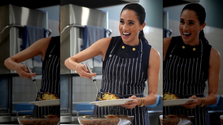Meghan Markle serving food