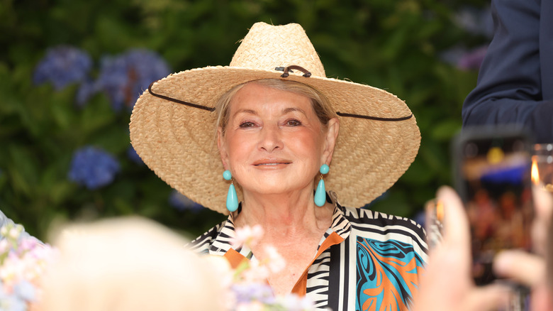 Martha Stewart smiling in a big hat