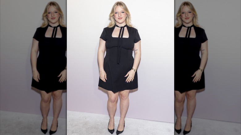 Francesca Scorsese posing in a little black dress and pointed black stilettos at an event for Valentino
