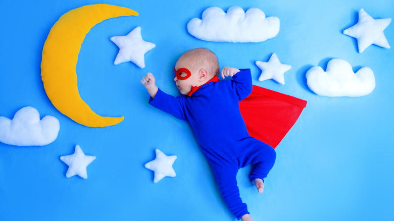 Baby dressed as superhero