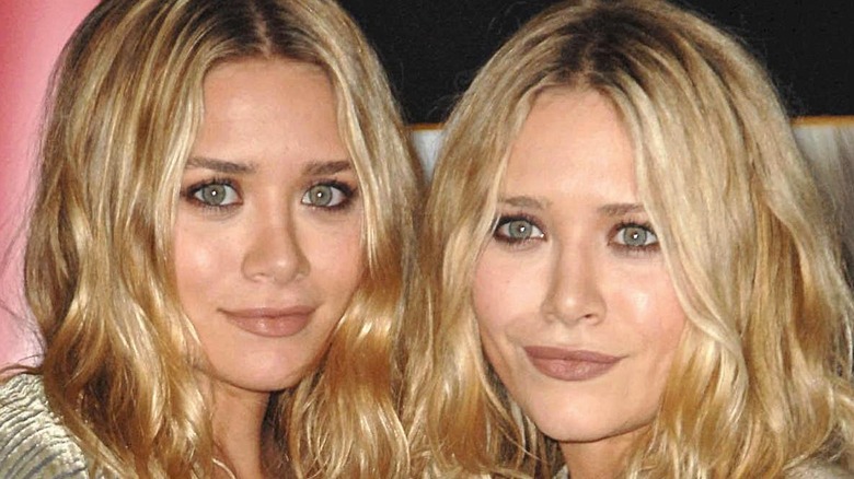 Mary Kate and Ashley Olsen wearing boho outfits on the red carpet