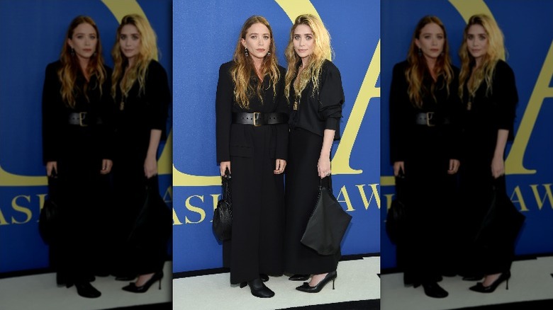 Mary Kate and Ashley Olsen wearing black on the red capet