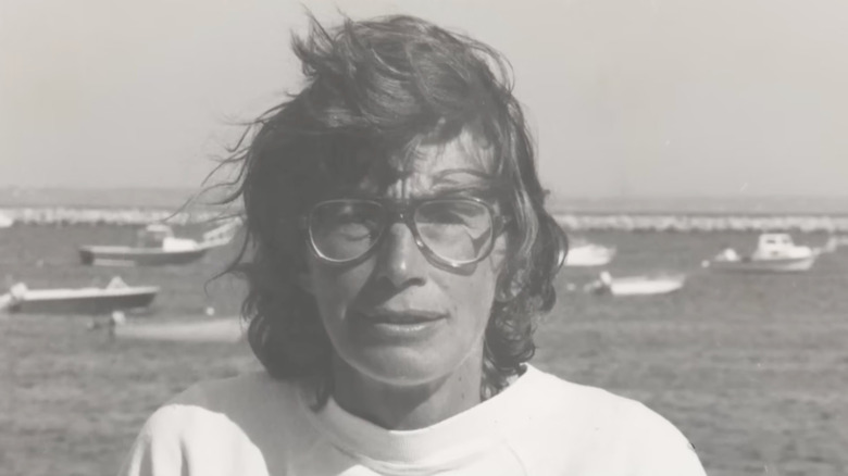 A photograph of Mary Oliver with the sea in the background