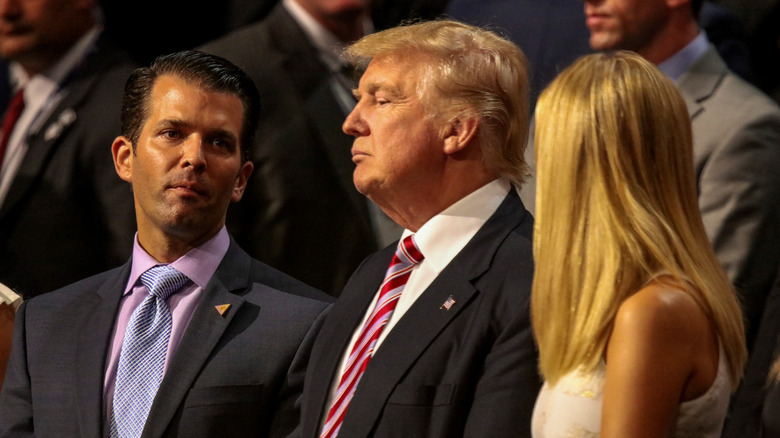 Donald Trump Jr., Donald Trump, and Ivanka Trump looking serious