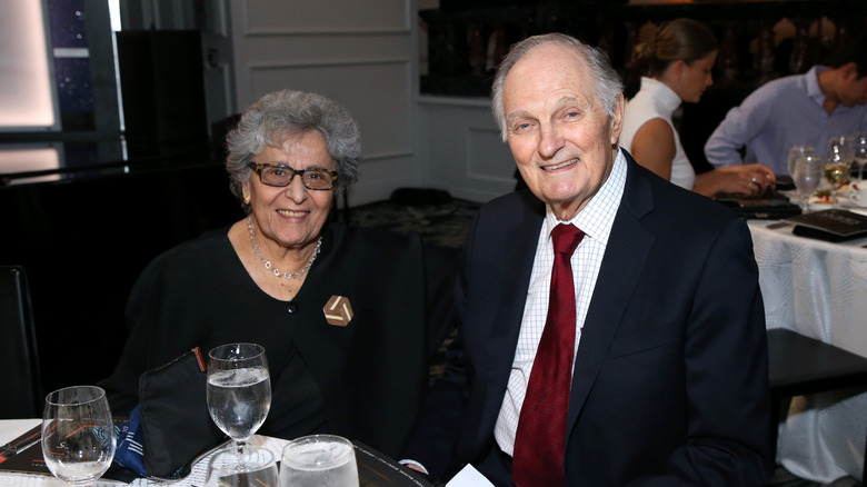 Arlene and Alan Alda smiling at a formal dinner