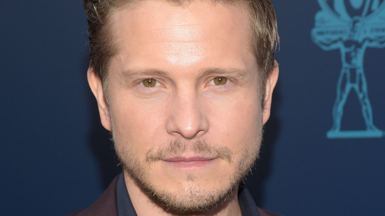 Matt Czuchry poses on the red carpet