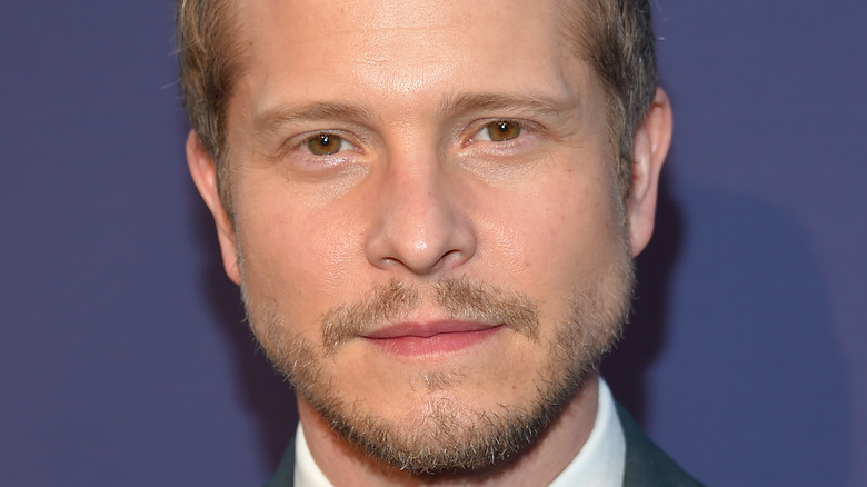 Matt Czuchry poses on the red carpet