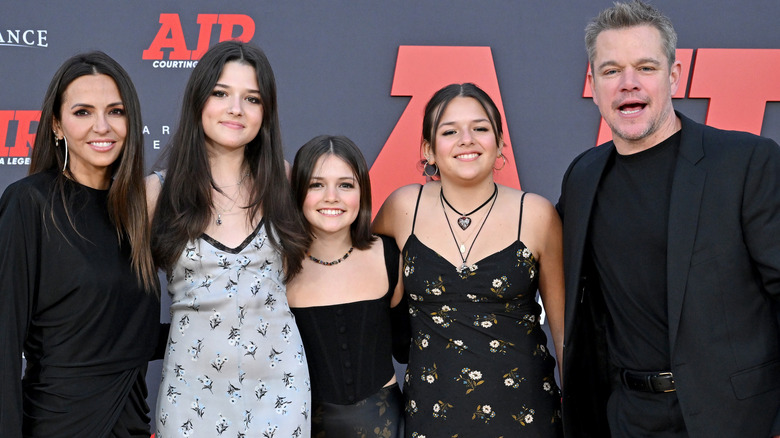 Matt Damon, Isabella Damon, Stella Damon, Gia Damon, and Luciana Barroso smiling at a premiere for Air