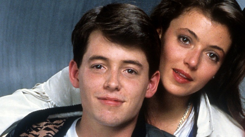 Matthew Broderick as Ferris Bueller with Mia Sara as Sloane Peterson behind him