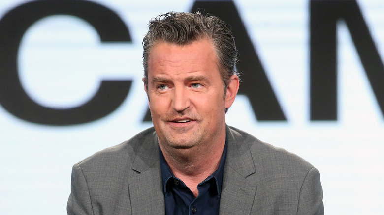 Actor Matthew Perry grey suit