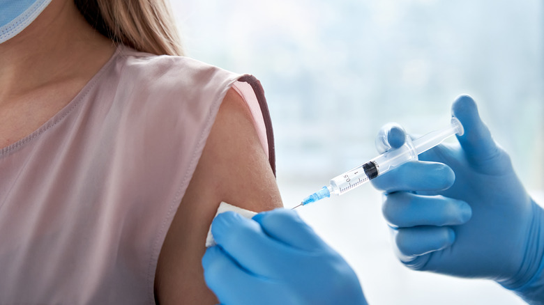 Woman receiving vaccine in arm