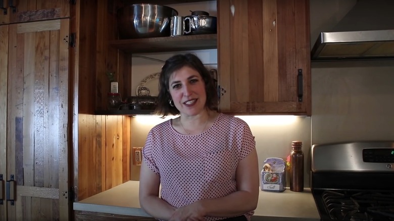 Mayim Bialik standing in her kitchen in 2020