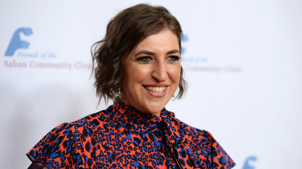 Mayim Bialik wears floral print and smiles