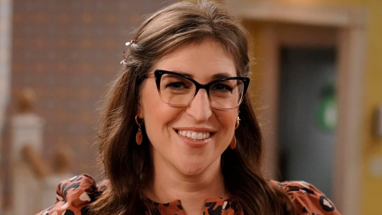 Close-up of Mayim Bialik smiling on the set of Call Me Kat
