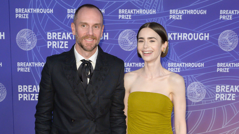 Lily Collins and Charlie McDowell posing at an event in 2026.