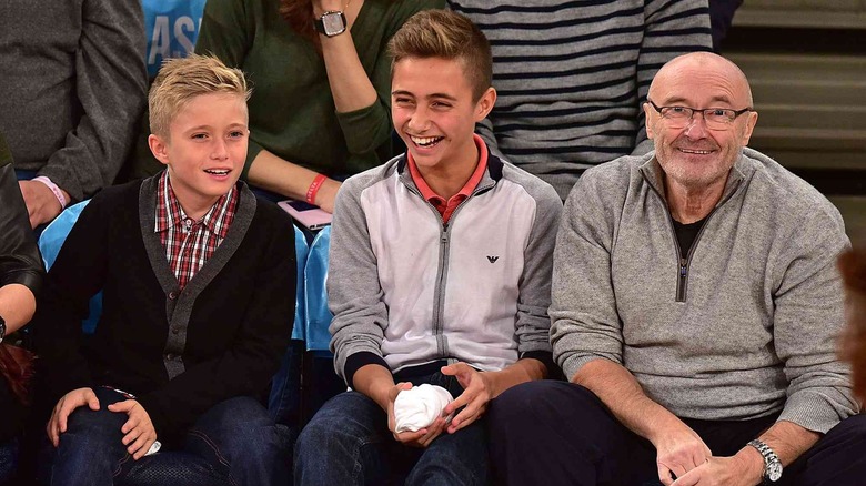 Phil, Nic, and Mathew Collins at a basketball game