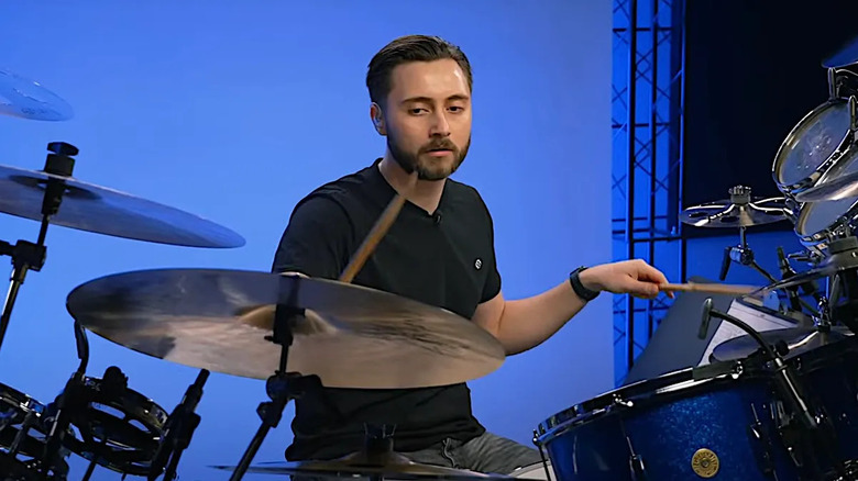 Nic Collins playing the drums.
