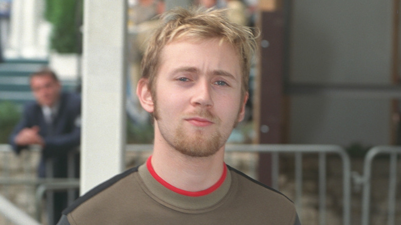 Simon Collins attending an event in 1999.