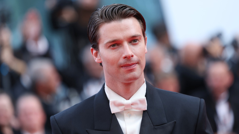 Patrick Schwarzenegger posing for photos