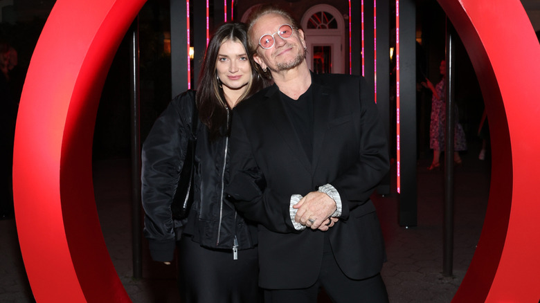 Eve Hewson and Bono pose together at an event