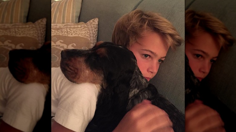 Charlie O'Donnell hugging his dog
