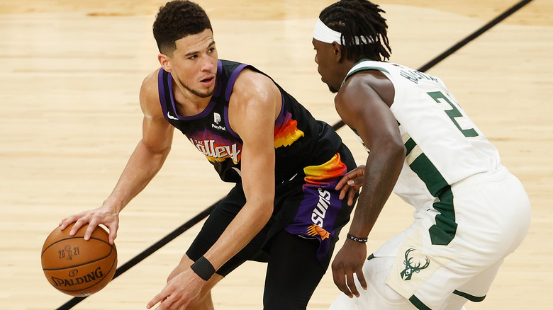 Devin Booker dribbles 