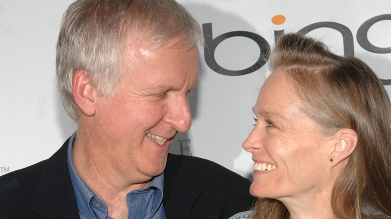 James Cameron and Suzy Amis gazing at each other lovingly
