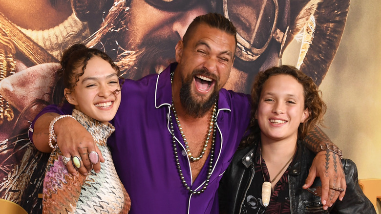 Jason Momoa posing with his children