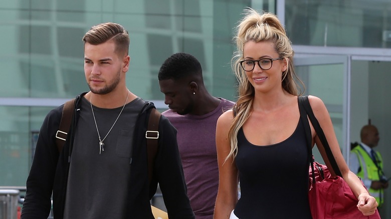 Chris Hughes and Oliva Attwood arriving back in the U.K. after "Love Island"