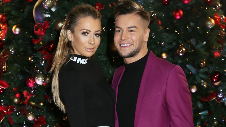 Chris Hughes and Olivia Attwood posing together in 2017