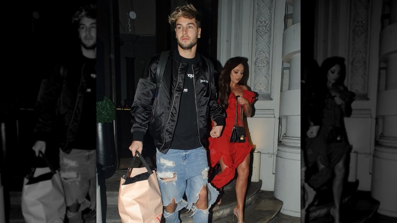 Chris Hughes and Jesy Nelson walking together outside