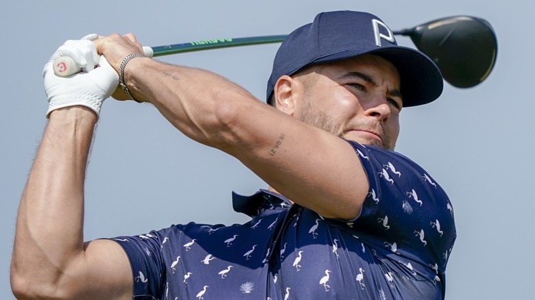 Chris Hughes golfing in 2023