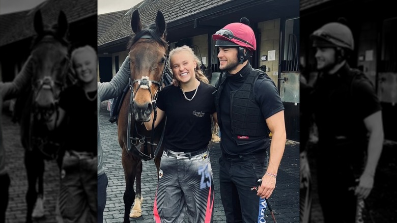 JoJo Siwa and Chris Hughes posing with a horse in 2025